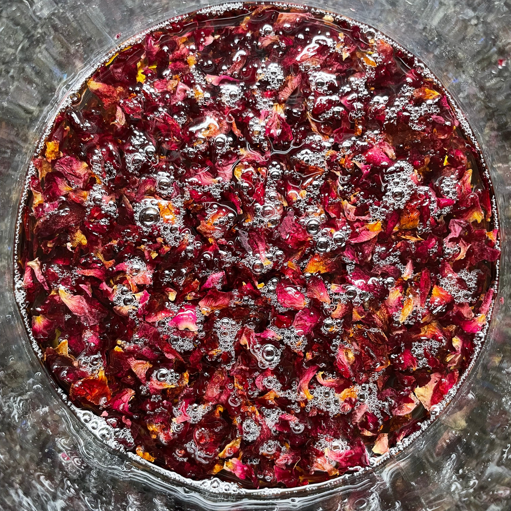 Rose petals infusing in oil